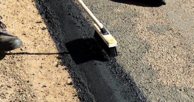 workers putting concrete on the road